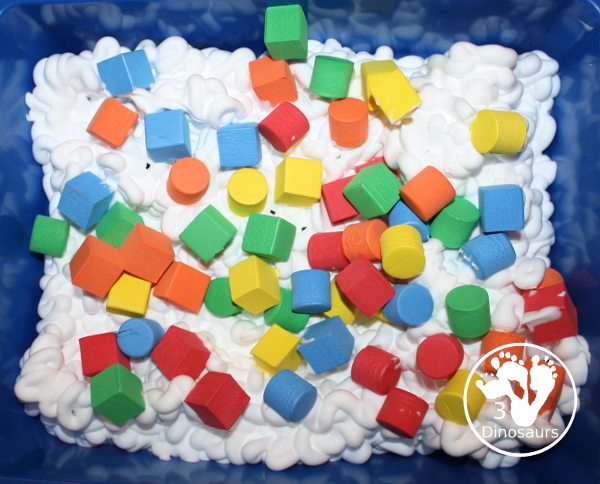 Shaving Cream and Foam Blocks Sensory Play - an easy to set up sensory play that can be done inside or outside with kids. It takes just a minute to set up with the shaving cream being the longest part. This is great for kids in preschool, prek, and kindergarten.  3Dinosaurs.com