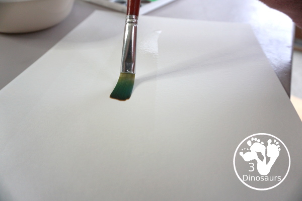 Snowflake Q-Tip Painting - a fun mixed art project that kids can do to paint snowflakes - 3Dinosaurs.com