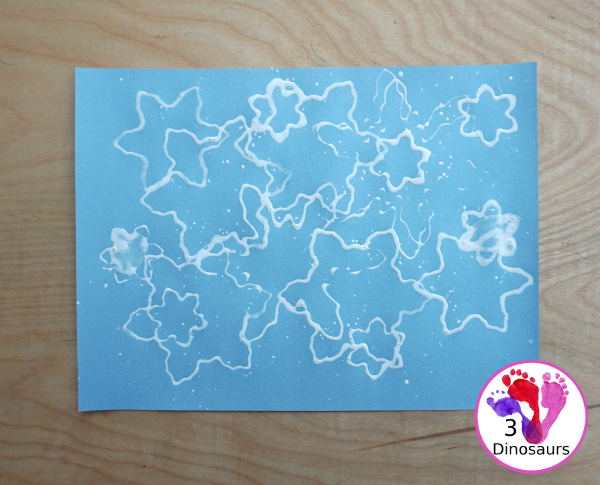 Making Snowflakes - Snowflake Cookie Cutter Painting - a simple painting craft that different ages of kids can do - 3Dinosaurs.com