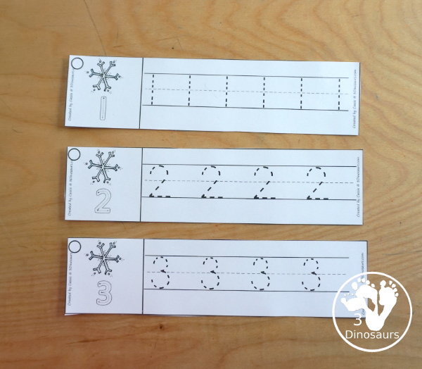 Free Snowflake Theme Number Tracing Strips - with numbers 0 to 20. You have number examples and them several numbers to trace - 3Dinosaurs.com