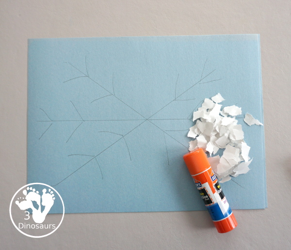 Torn Paper Snowflakes - a fun torn paper winter craft that kids can do and have a blast making - 3Dinosaurs.com