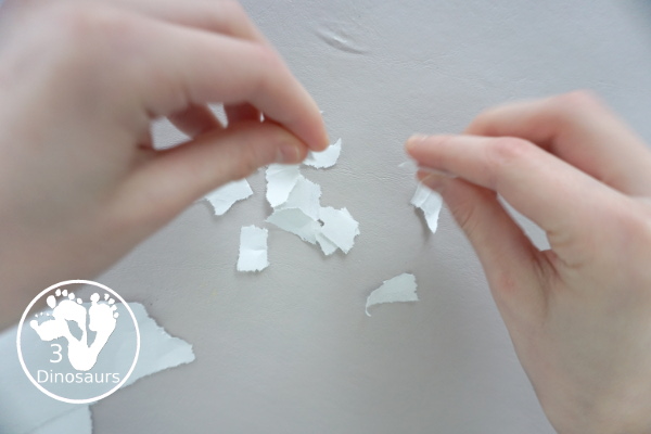 Torn Paper Snowflakes - a fun torn paper winter craft that kids can do and have a blast making - 3Dinosaurs.com