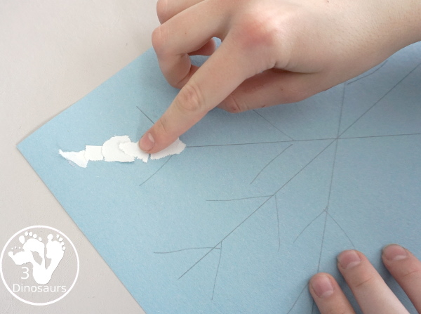 Torn Paper Snowflakes - a fun torn paper winter craft that kids can do and have a blast making - 3Dinosaurs.com