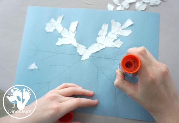 Torn Paper Snowflakes - a fun torn paper winter craft that kids can do and have a blast making - 3Dinosaurs.com