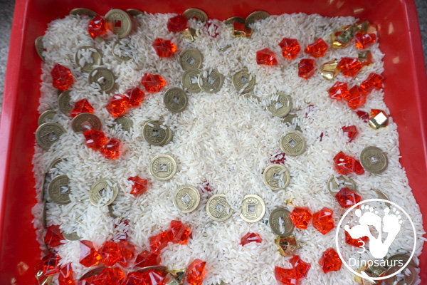 Lunar New Year Sensory Bin - a fun sensory bin with rice, coins, and red rocks for a simple and easy to put together sensory bin for Chinese New year or Lunar New Year- 3Dinosaurs.com
