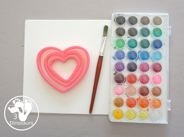Watercolor Hearts Painting For Kids - a fun painting activity using watercolor and cookie cutters to make a really fun painting for Valentines - 3Dinosaurs.com