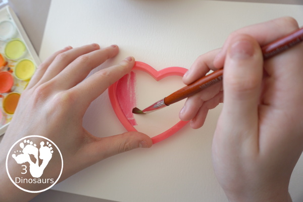 Watercolor Hearts Painting For Kids - a fun painting activity using watercolor and cookie cutters to make a really fun painting for Valentines - 3Dinosaurs.com