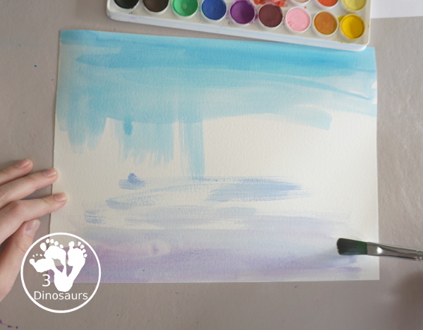 Winter Cardinal Painting for Kids is a great winter painting with watercolors, and cardinal cookie cutter to make a great winter painting. - 3Dinosaurs.com