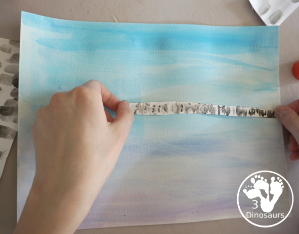 Winter Cardinal Painting for Kids is a great winter painting with watercolors, and cardinal cookie cutter to make a great winter painting. - 3Dinosaurs.com