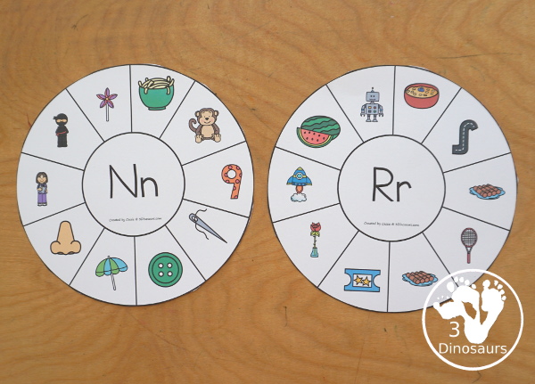Alphabet Beginning Sound Clip Wheel Printable - all 26 letters of the alphabet with letters in the middle and images around the wheel for kids to clip the words that have that letter sound. There are bookmarks to use as answer keys. - 3Dinosaurs.com
