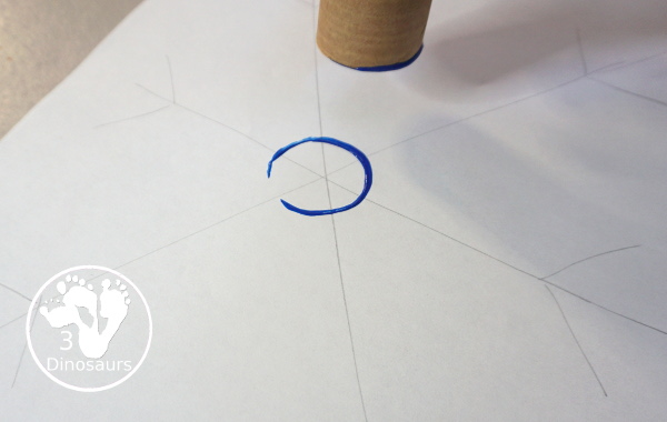 Paper Roll Painted Snowflake - a fun snowflake painting with blue and purple colors and using paper rolls to make the snowflakes. A simple and easy PreK and kindergarten craft for winter. - 3Dinosaurs.com