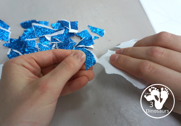 Torn Paper Glitter Snowflake Craft - a fun torn paper craft to make snowflakes out of glitter paper a fun winter craft for kids. - 3Dinosaurs.com