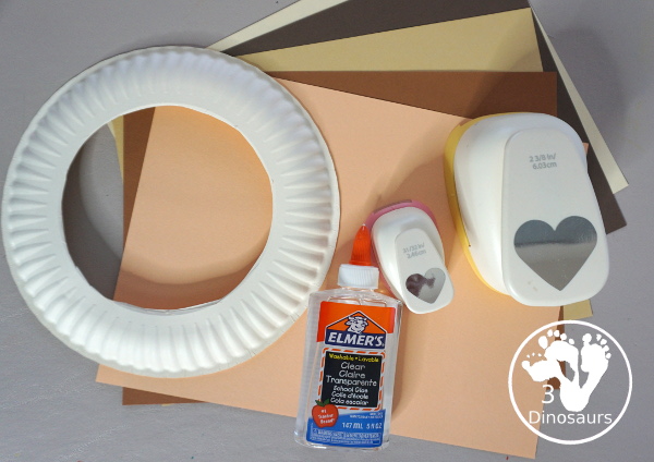 Black History Month Heart Wreath Craft - a simple wreath made with hearts of different shades of skin color for Black history month or Martin Luther King Jr Day. An easy craft to do with kids. - 3Dinosaurs.com