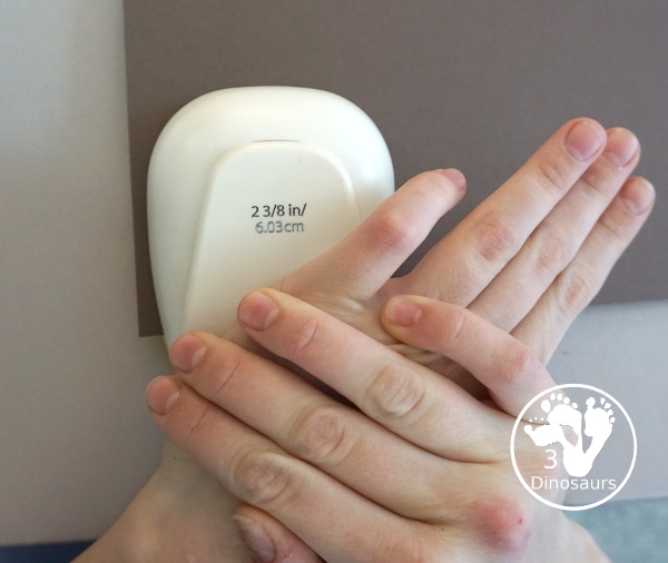 Black History Month Heart Wreath Craft - a simple wreath made with hearts of different shades of skin color for Black history month or Martin Luther King Jr Day. An easy craft to do with kids. - 3Dinosaurs.com