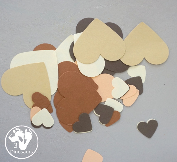 Black History Month Heart Wreath Craft - a simple wreath made with hearts of different shades of skin color for Black history month or Martin Luther King Jr Day. An easy craft to do with kids. - 3Dinosaurs.com
