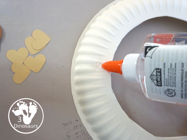 Black History Month Heart Wreath Craft - a simple wreath made with hearts of different shades of skin color for Black history month or Martin Luther King Jr Day. An easy craft to do with kids. - 3Dinosaurs.com