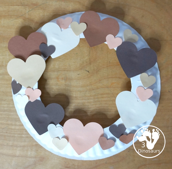 Black History Month Heart Wreath Craft - a simple wreath made with hearts of different shades of skin color for Black history month or Martin Luther King Jr Day. An easy craft to do with kids. - 3Dinosaurs.com