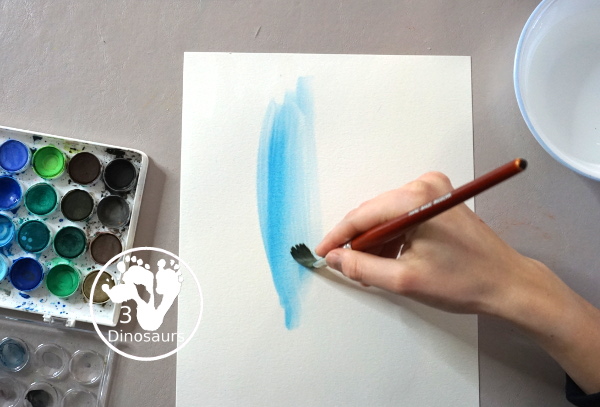 Winter Tree Painting Craft For Kids a fun mixed watercolor and q-tip painting winter tree for kids. A fun winter painting idea for kids that can do at different levels. - 3Dinosaurs.com