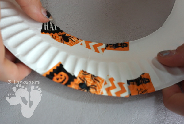 Fun Fine Motor Craft: Washi Tape Halloween Wreath - kids will get will work on fine motor skills while making a fun wreath for Halloween. - 3Dinosaurs.com