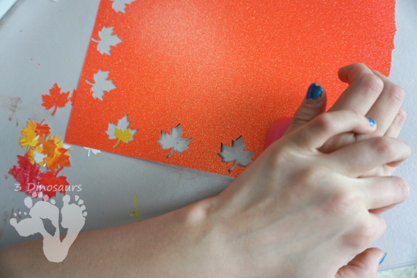 Fall Leaf Themed Wreath - fun wreath that kids can make with oil pastels and leaf punches - 3Dinosaurs.com 