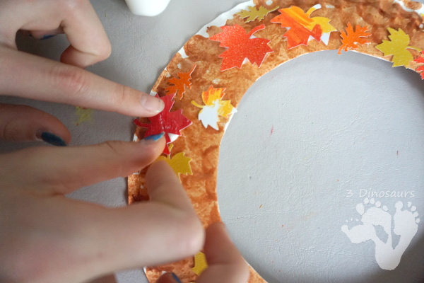 Fall Leaf Themed Wreath - fun wreath that kids can make with oil pastels and leaf punches - 3Dinosaurs.com 