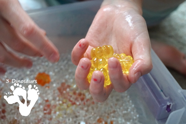 Pumpkin Water Beads Sensory Bin - fun sensory play with clear water beads and acrylic pumpkins make a fun sensory play for the fall - 3Dinosaurs.com