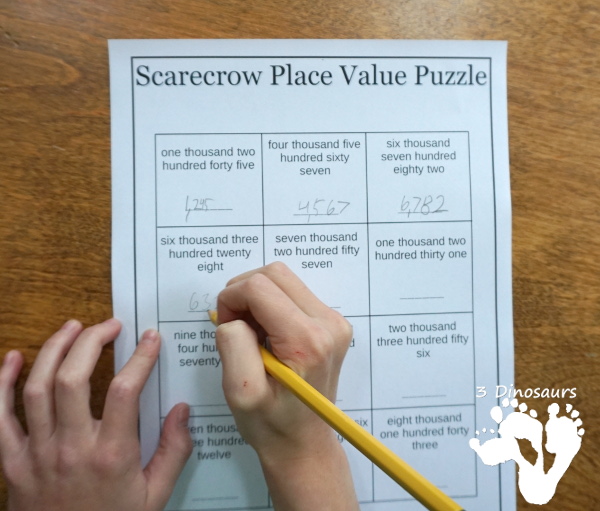 Free Scarecrow Place Value Puzzles - fun puzzles to work on place value with two options of tens and ones or thousand, hundreds, tens and ones with recording sheets, and puzzle mat - 3Dinosaurs.com