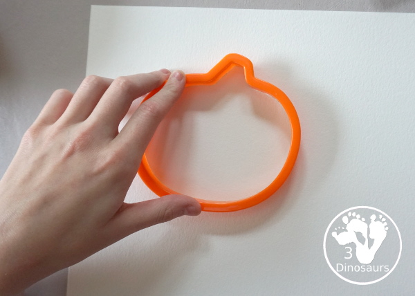 Pumpkin Cookie Cutter Watercolor Painting - a fun watercolor painting activity with pumpkin cookie cutters to make the pumpkins. Simple pumpkin paintings that different ages can do. - 3Dinosaurs.com