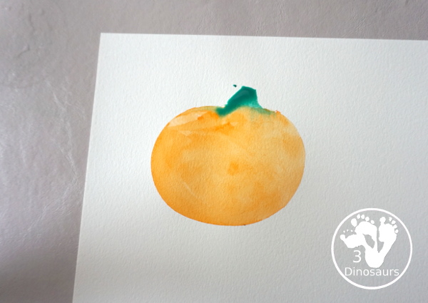 Pumpkin Cookie Cutter Watercolor Painting - a fun watercolor painting activity with pumpkin cookie cutters to make the pumpkins. Simple pumpkin paintings that different ages can do. - 3Dinosaurs.com