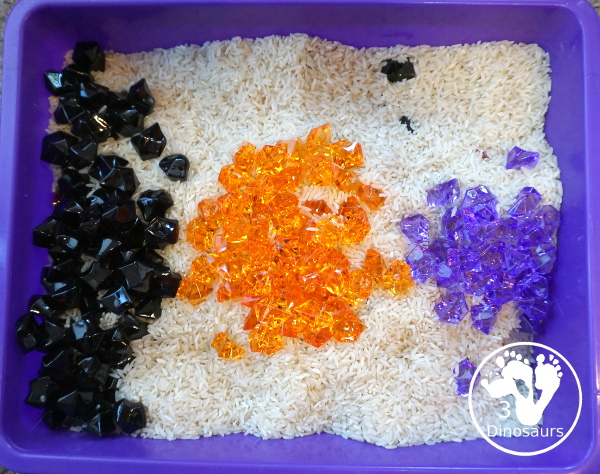 Halloween Black, Orange, and Purple Sensory Bin - a fun rice base sensory bin with colors black, orange and purple for the colors.- 3Dinosaurs.com
