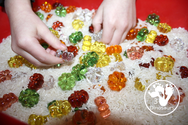 Pumpkin rice Sensory Bin - a simple rice sensory bin with pumpkins for a small sensory play for October and November - 3Dinosaurs.com