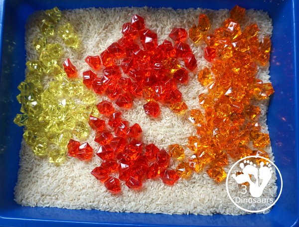 Red Yellow & Orange Sensory Bin - a fun fall color sensory bin. It is super simple to set up and easy for kids to explore the colors. - 3Dinosaurs.com