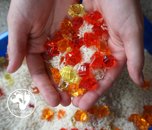 Red Yellow & Orange Sensory Bin - a fun fall color sensory bin. It is super simple to set up and easy for kids to explore the colors. - 3Dinosaurs.com