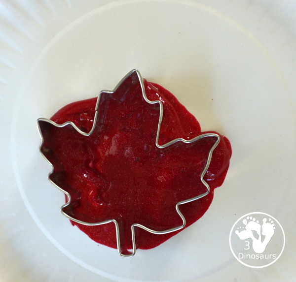 Fall Tree Scrape Painting with Leaf Cookie Cutters - a simple watercolor trunk and branches with leaf cookie cutter scrape painting. A great fall tree craft for kids. 3Dinosaurs.com