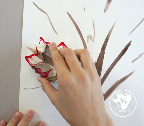 Fall Tree Scrape Painting with Leaf Cookie Cutters - a simple watercolor trunk and branches with leaf cookie cutter scrape painting. A great fall tree craft for kids. 3Dinosaurs.com