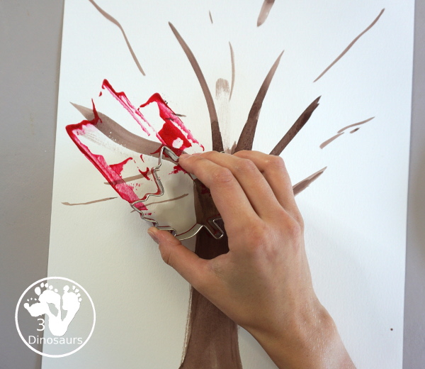 Fall Tree Scrape Painting with Leaf Cookie Cutters - a simple watercolor trunk and branches with leaf cookie cutter scrape painting. A great fall tree craft for kids. 3Dinosaurs.com