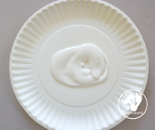 Ghost Scrape Painting with Cookie Cutters - a simple painting activity for kids with paint and ghost cookie cutters that different ages can make together for Halloween. - 3Dinosaurs.com