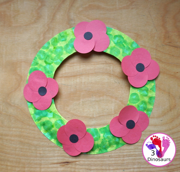 Poppy Flower Wreath Craft for Kids for Veteran's Day. A great way to remember veterans and all they have done. These are great to make for remembrance days, veterans day and memorial day - 3Dinosaurs.com