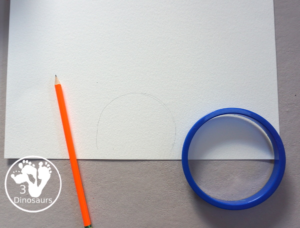 Turkey Feather Scrap Painting for Kids - a fun turkey craft made with a cookie cutter feather and construction paper. A fun painting idea with feathers for a Thanksgiving craft for kids in preschool, prek, and kindergarten. 3Dinosaurs.com