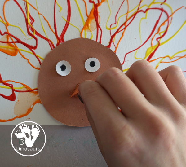 Turkey Feather Stamp Painting for Kids - a fun turkey craft made with a cookie cutter feather and construction paper. A fun idea for a Thanksgiving craft for kids in preschool, prek, and kindergarten. 3Dinosaurs.com