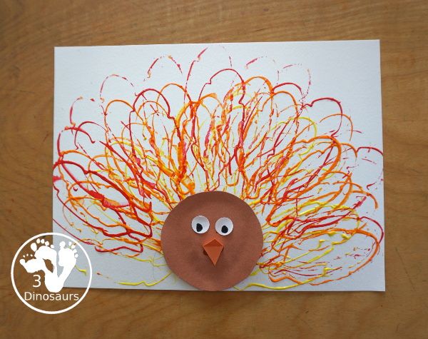 Turkey Feather Stamp Painting for Kids - a fun turkey craft made with a cookie cutter feather and construction paper. A fun idea for a Thanksgiving craft for kids in preschool, prek, and kindergarten. 3Dinosaurs.com