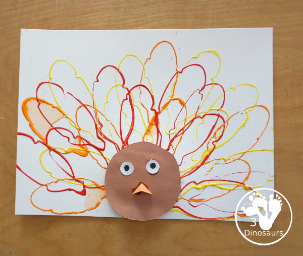 Turkey Feather Stamp Painting for Kids - a fun turkey craft made with a cookie cutter feather and construction paper. A fun idea for a Thanksgiving craft for kids in preschool, prek, and kindergarten. 3Dinosaurs.com