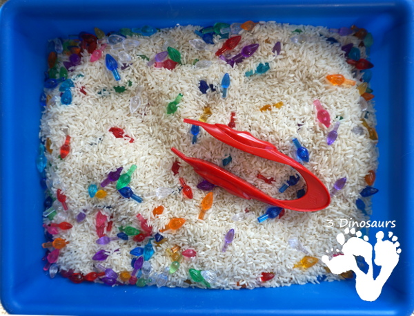 Christmas Lights & Rice Sensory Bin - simple and easy to set up sensor bin for kids to play in and great for sensory play - 3Dinosaurs.com