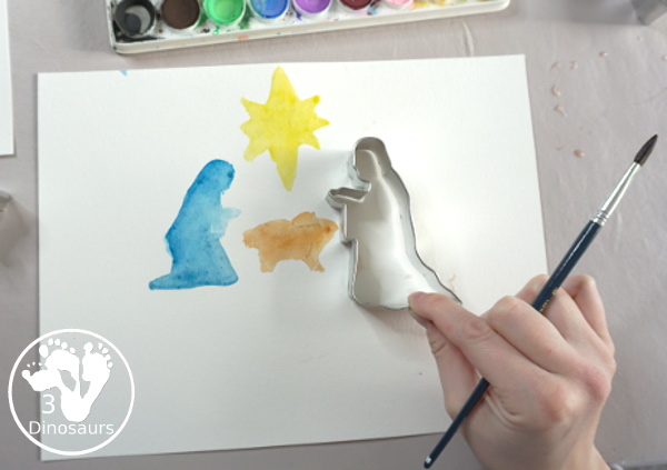 Nativity Watercolor Painting for kids - a simple way to make a Nativity scene with watercolors and cookies cutters. A great way to work on retelling the nativity story - 3Dinosaurs.com