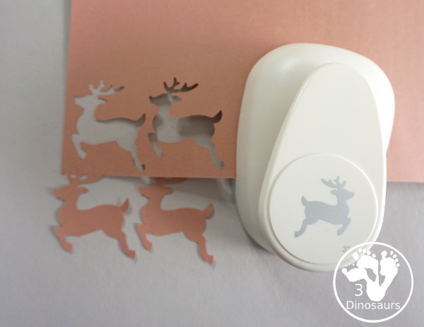 Reindeer Christmas Wreath Craft - a super easy wreath made with reindeer punches and tree punches that kids can make - 3Dinosaurs.com