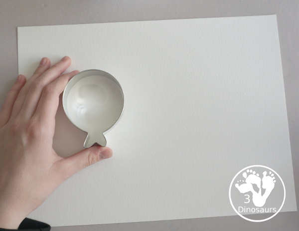 Balloon Watercolor Painting with Cookie Cutters - a simple watercolor painting with a balloon cookie cutter that kids of all ages can do for a party or New Year's Eve - 3Dinosaurs.com