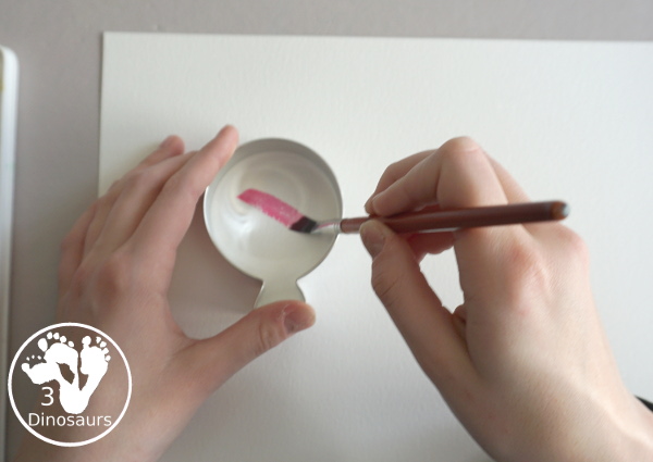 Balloon Watercolor Painting with Cookie Cutters - a simple watercolor painting with a balloon cookie cutter that kids of all ages can do for a party or New Year's Eve - 3Dinosaurs.com