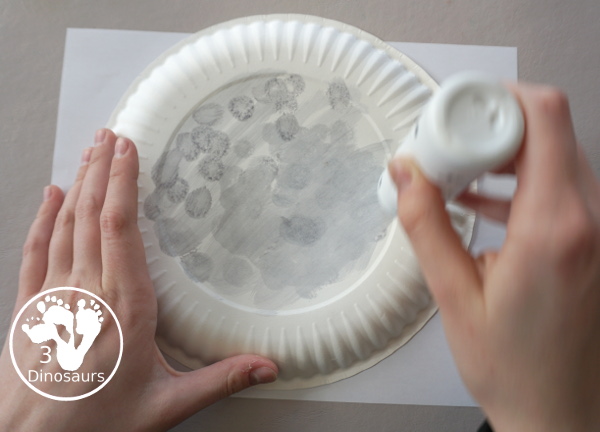 New Years Glitter Ball Craft - made with a paper plate, dot marker, glue nad glitter cardstock. A great New Years Eve craft for kids.- 3Dinosaurs.com