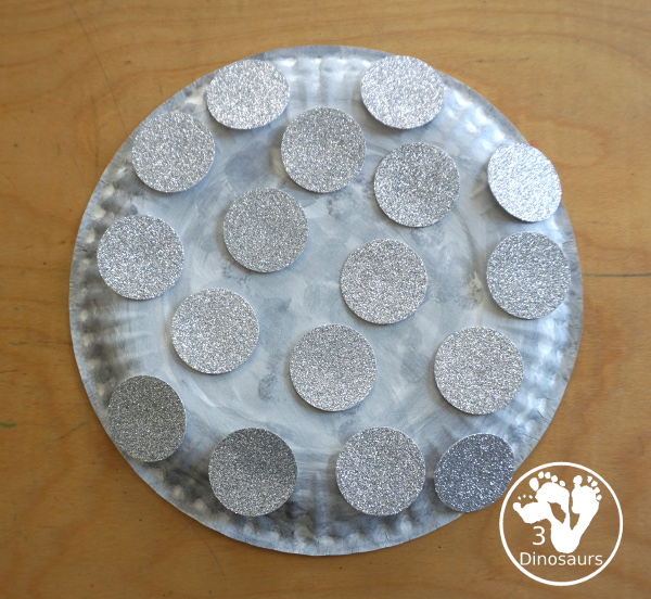 New Years Glitter Ball Craft - made with a paper plate, dot marker, glue nad glitter cardstock. A great New Years Eve craft for kids.- 3Dinosaurs.com