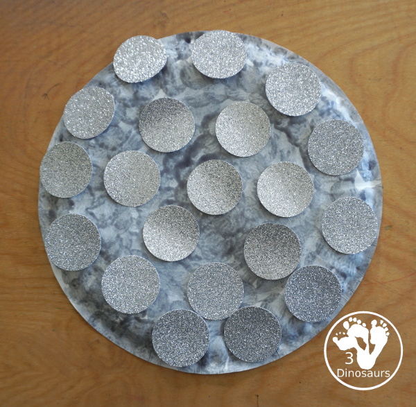 New Years Glitter Ball Craft - made with a paper plate, dot marker, glue nad glitter cardstock. A great New Years Eve craft for kids.- 3Dinosaurs.com